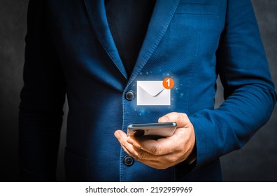 Businessman holding cellphone with virtual letter icon for application notification alert concept. Hand of businessman using smartphone for email with notification alert, Online communication concept