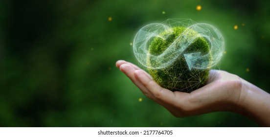 businessman holding circular economy icon Circular economy concept for future business growth and environmental sustainability and reduce pollution for future business and environmental growth.