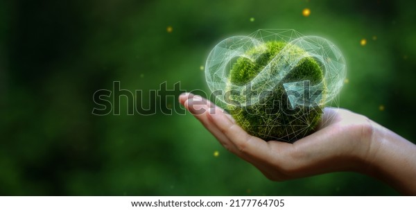 businessman holding circular economy icon\
Circular economy concept for future business growth and\
environmental sustainability and reduce pollution for future\
business and environmental\
growth.