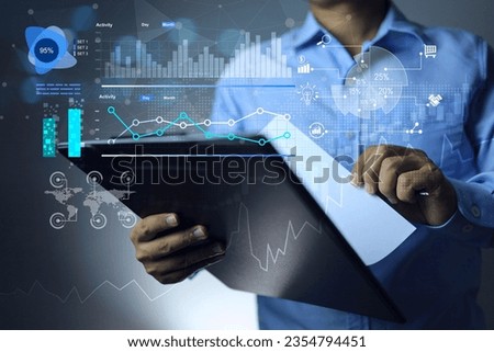 Businessman holding clipboard and looking at paper to read earning report or business profit and loss for financial accounting analysis and strategy planning to adjust investment balance each country.