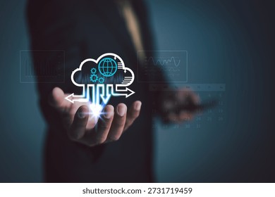 Businessman holding a cloud computing interface with data flow, analytics charts, and digital network elements, representing modern cloud technology, data management, and scalable business infrastructure.