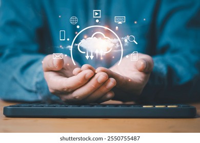 Businessman holding cloud computing with technology icon include computer newsletter file document for upload and download concept.