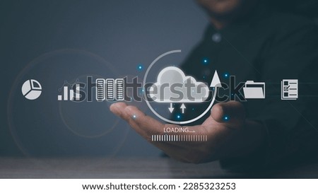 Businessman holding cloud computing technology. Data storage security online in Networking and internet service. Connect devices to cloud. Cloud computing concept.
