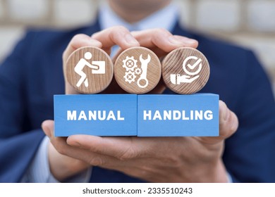Businessman holding colorful blocks with icons and inscription: MANUAL HANDLING. Concept of manual handling. Right and Wrong Manual Handling and Lifting of Heavy Goods.