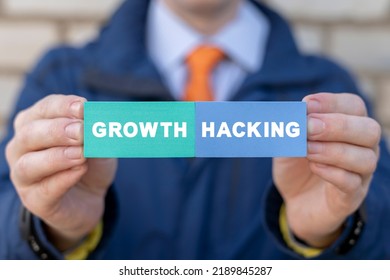 Businessman holding colorful styrofoam blocks with growth hacking inscription. Growth Hacking Business Marketing Concept. 