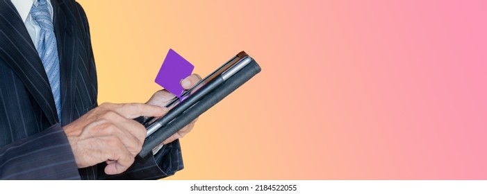 Businessman Holding Credit Card And Tablet. Empty Credit Card Prototype In Hand.