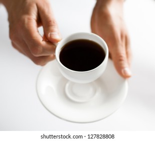 Businessman holding a cup of delicious coffee aroma - Powered by Shutterstock