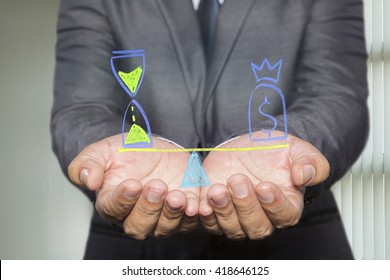 Businessman holding diagram with Scales in equal balance holding a clock left on the and money on the right. - Powered by Shutterstock