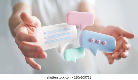 Businessman holding digital colorful speech bubbles talk icons. Minimal conversation or social media messages floating between man hands. 3D rendering