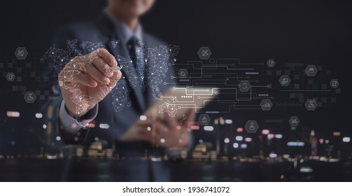 Businessman holding digital tablet with global logistics network and transportation on virtual screen. Smart logistics, E-commerce, Internet of Things, digital marketing, business strategy concept - Shutterstock ID 1936741072