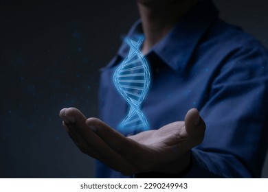 Businessman holding DNA symbol.Digital healthcare and network connection on virtual interface, medical technology and innovation concept. - Powered by Shutterstock