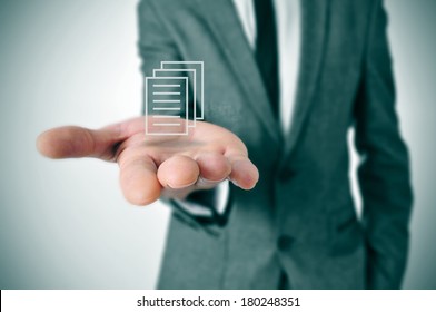 A Businessman Holding A Document Icon In His Hand