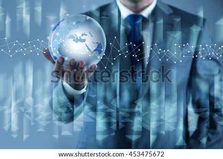 Businessman holding earth in global concept