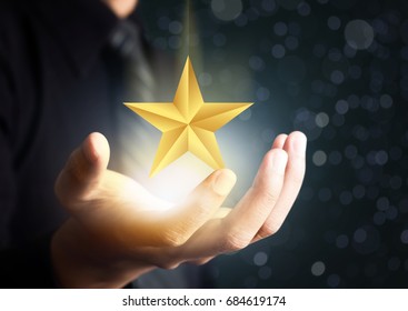 Businessman Holding Excellence Star