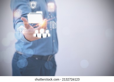 A Businessman holding a file document icon virtual online with business icons. Database and process automation to manage files, knowledge, and Document of corporate. Document Management System.  - Shutterstock ID 2132726123