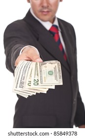 businessman holding and giving away dollar bills