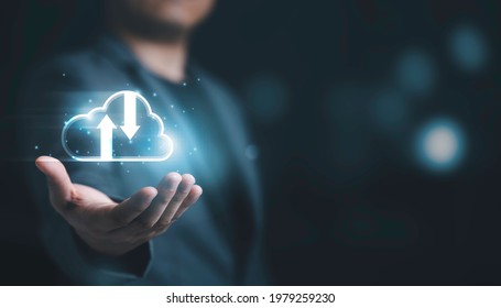 Businessman holding and giving virtual cloud computing with copy space to transfer data information and upload download application. Technology transformation concept. - Shutterstock ID 1979259230