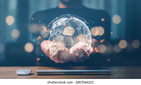businessman holding Global network connection. Big data analytics and business intelligence concept. World map point and line composition concept of global business.Digital link tech. - Shutterstock ID 2007066221