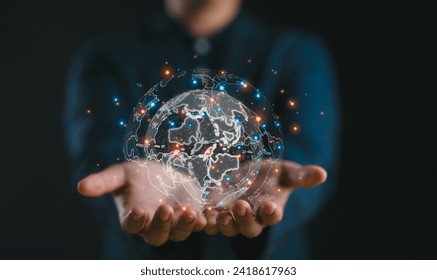 Businessman holding Global network connection. Big data analytics and business intelligence concept. World map point and line composition concept of global business.Digital link tech.