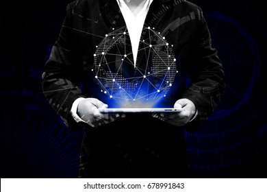 Businessman holding globe in digital tablet with social media, mixed media. Technologies  and network connection concept.
