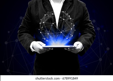 Businessman holding globe in digital tablet with social media, mixed media. Technologies  and network connection concept.