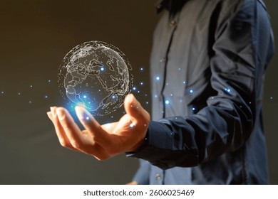 Businessman holding globe icon showing global big network connection. Data analysis and business intelligence concept. Points and lines elements concept on world map. Digital link technology.