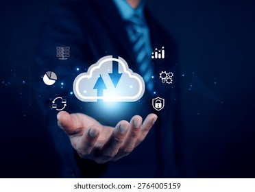 Businessman holding glowing cloud computing icon with data transfer arrows, representing digital transformation, cloud storage, cybersecurity, analytics, and network technology