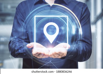 Businessman Holding Glowing Geolocation Gps Interface. Geolocation And Distributed Data Concept