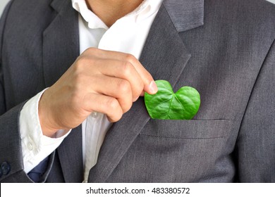  Businessman Holding A Green Heart Leaf / Business With Corporate Social Responsibility And Environmental Concern                              