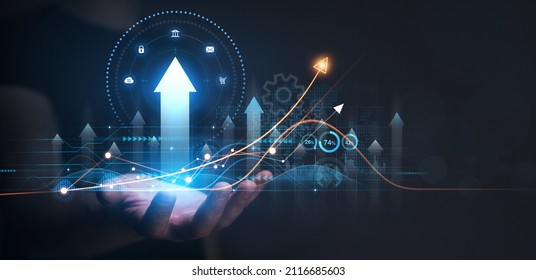 Businessman holding growing virtual hologram of statistics, graph and chart. Investment of growth on currency rate.Digital marketing concept. - Shutterstock ID 2116685603