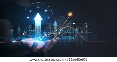 Businessman holding growing virtual hologram of statistics, graph and chart. Investment of growth on currency rate.Digital marketing concept.