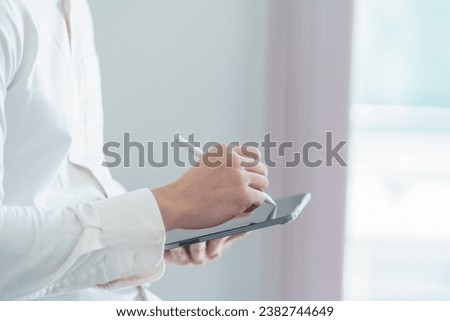 Similar – Female doctor filling out a questionnaire