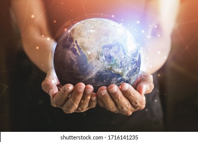 Businessman Holding In Hands With Global Connection Concept. Energy Saving Concept, Elements Of This Image Furnished By NASA