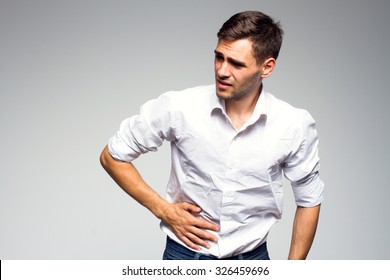 Businessman Holding His Stomach In Pain