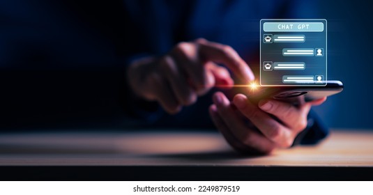 Businessman holding hologram Chat GPT virtual icon on smartphone intelligence Ai, Chat GPT Chat with AI Artificial Intelligence, Futuristic technology, robot in online system. - Shutterstock ID 2249879519