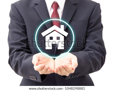 businessman holding house icon, homeloan and insurance concept