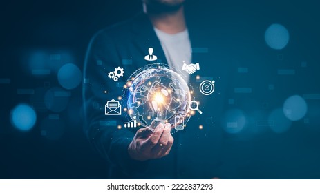 businessman holding light blub with virtual Global Internet connection. global internet connection application technology and digital marketing, Financial and banking, Digital link tech, big data. - Powered by Shutterstock