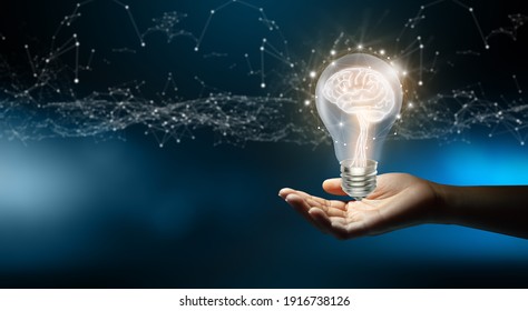 Businessman holding Light bulbs with Brain inside and Low poly wireframe outside. Creative and innovation inspiration. Business Bright idea concept.