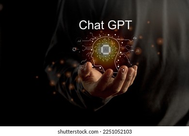 Businessman holding a light chatbot hologram  intelligence AI. Chat GPT chat with AI Artifice intelligent developers by OpenAI generate.  - Shutterstock ID 2251052103