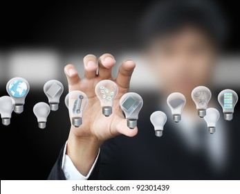 Businessman Holding Lightbulb