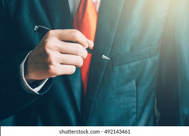 Businessman Holding A Pen