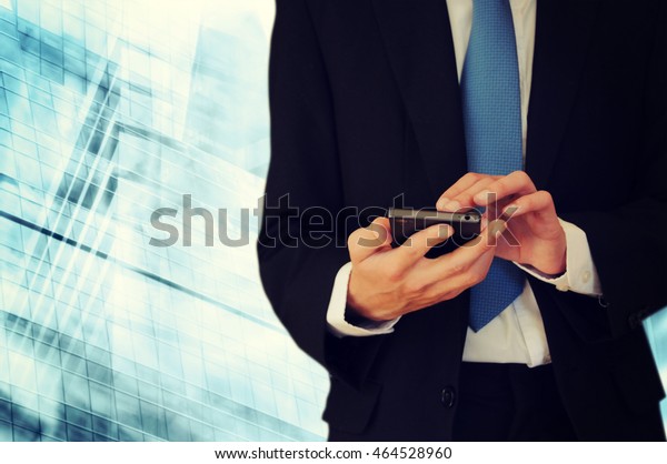 Businessman holding\
phone