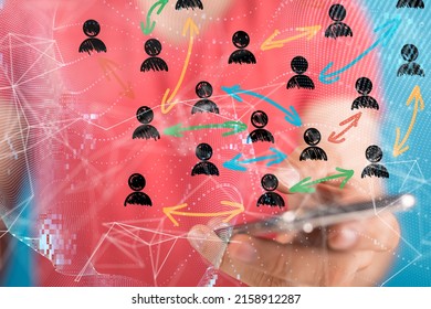 A businessman holding a phone with a render of connected profile icons- HR concept