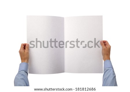 Businessman holding and reading a blank newspaper with copy space from above