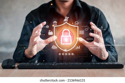 Businessman holding shield protect icon. Protection network security computer and safe your data concept, lock symbol, concept about security, cybersecurity and protection against dangers. - Shutterstock ID 2136966131
