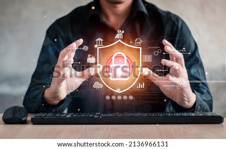 Businessman holding shield protect icon. Protection network security computer and safe your data concept, lock symbol, concept about security, cybersecurity and protection against dangers.