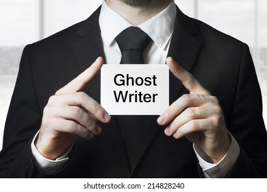 Businessman Holding Sign Ghost Writer Plagiarism