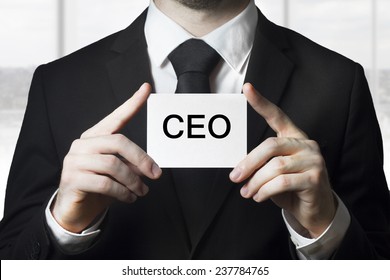 Businessman Holding Small White Sign Ceo