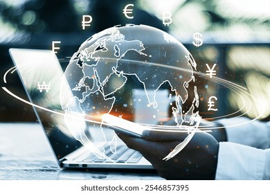 Businessman holding smartphone with holographic world map and currency symbols. Modern technology and finance concept on blurred background