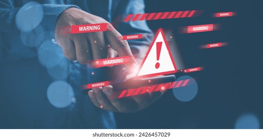 Businessman holding a smartphone turn on with triangle caution warning. cyber attack on online network error system. Triangle caution warning sign exclamation, warning sign red for notification error.